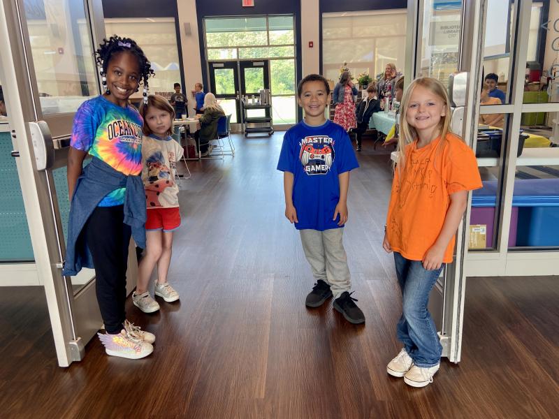 Welcoming guests to the school library are (l-r) Kaleela Lee, Kairi Campbell, Michael Francis and Swayzee Weatherspoon.